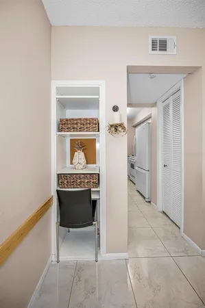 a kitchen with granite countertop a sink a stove and cabinets