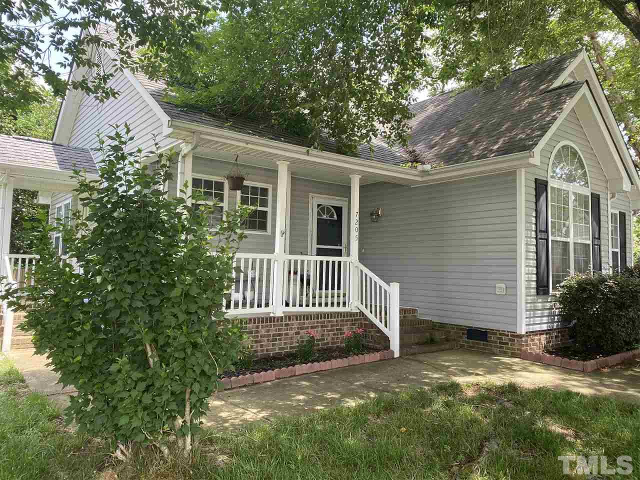 7205 Spanglers Spring Way Raleigh, NC 27610 - Photo 1 of 4 a view of back yard of the house