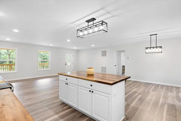 a view of a kitchen counter space with wooden floor