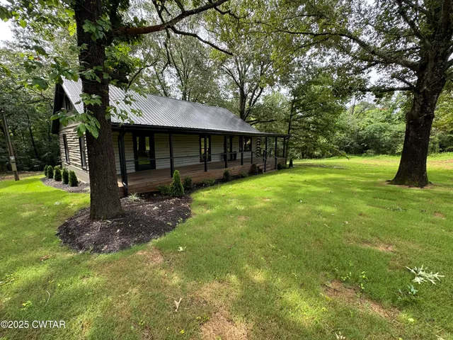 a view of porch with wooden floor