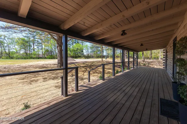 a view of balcony with wooden floor
