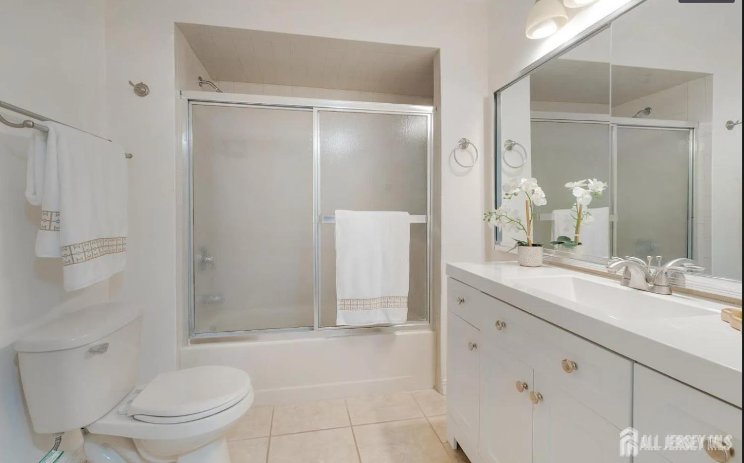 31 Gate House Lane Edison, NJ 08820 - Photo 14 of 15 a bathroom with a granite countertop sink toilet and shower