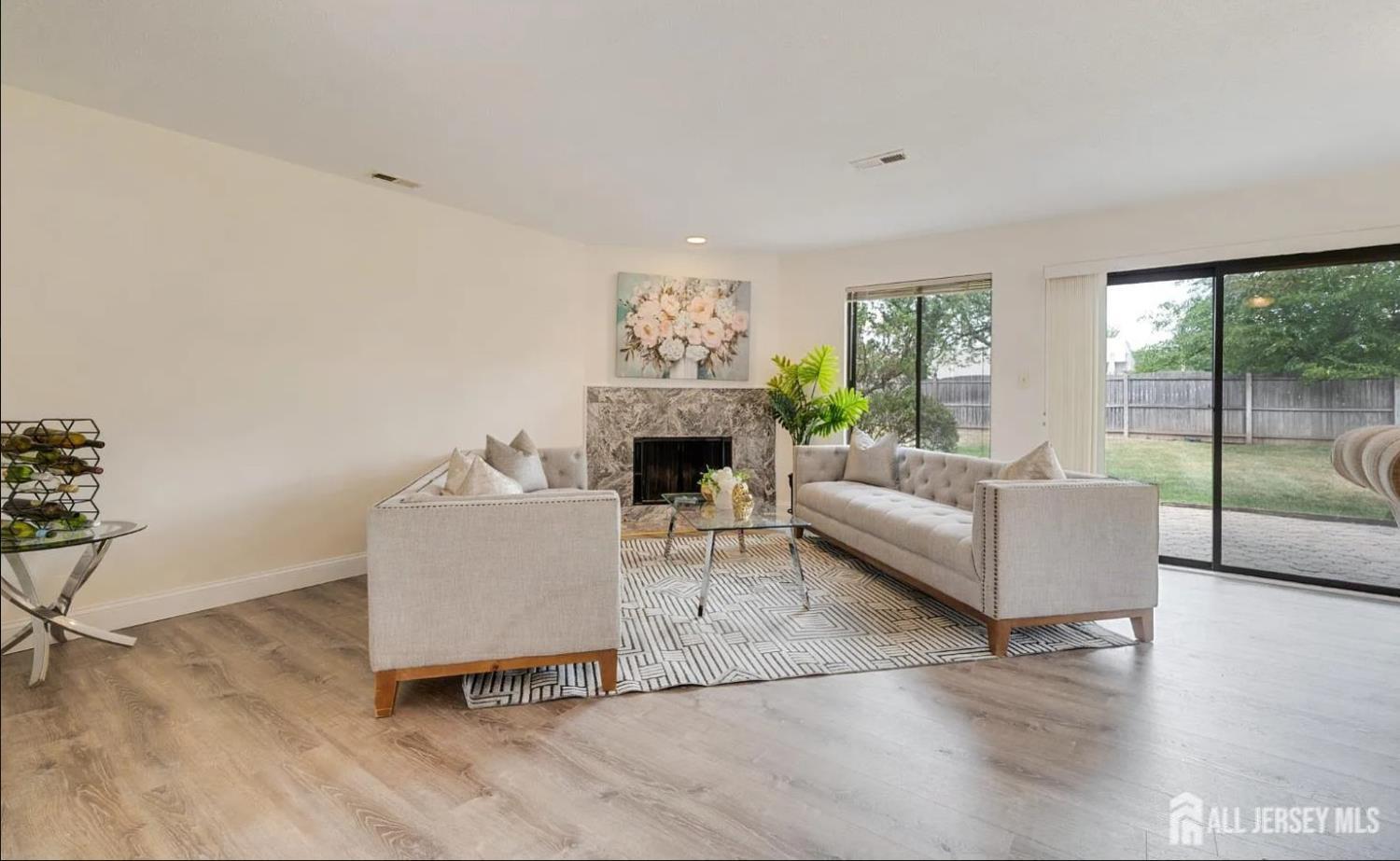 31 Gate House Lane Edison, NJ 08820 - Photo 6 of 15 a living room with furniture and a fireplace