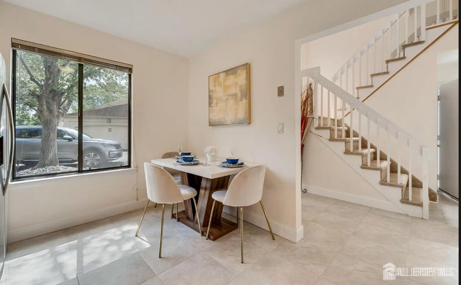 31 Gate House Lane Edison, NJ 08820 - Photo 9 of 15 a view of a dining room with furniture window and wooden floor