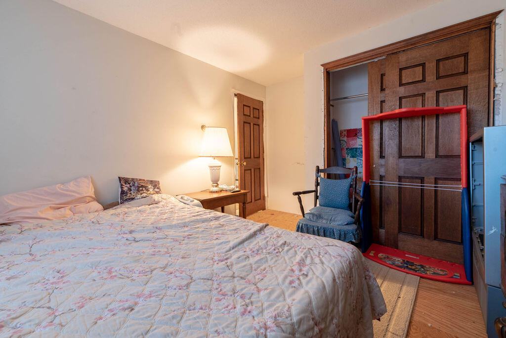 44 Deerfield Road Mashpee, MA 02649 - Photo 13 of 17 a bedroom with a bed and a closet