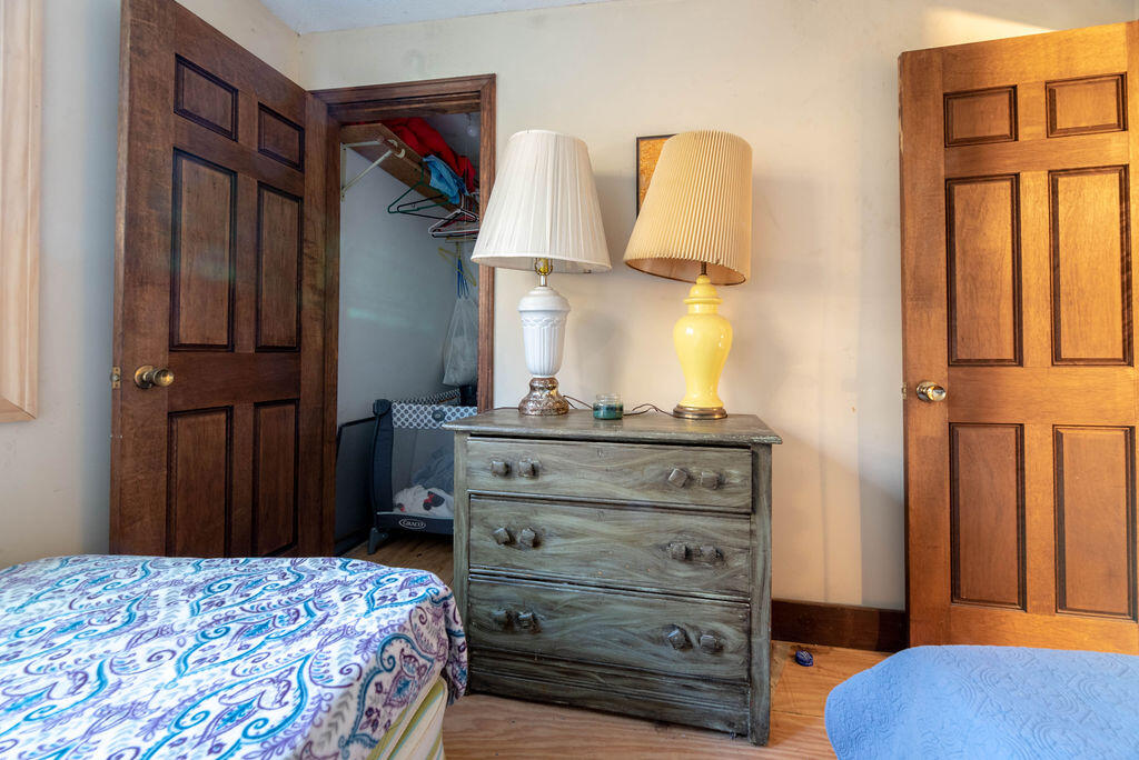 44 Deerfield Road Mashpee, MA 02649 - Photo 14 of 17 a bedroom with a bed and cabinets