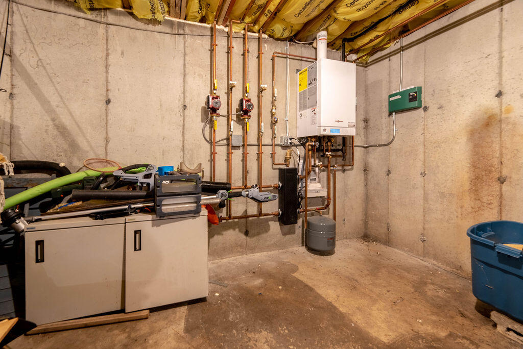 44 Deerfield Road Mashpee, MA 02649 - Photo 17 of 17 a kitchen with a stove and a refrigerator