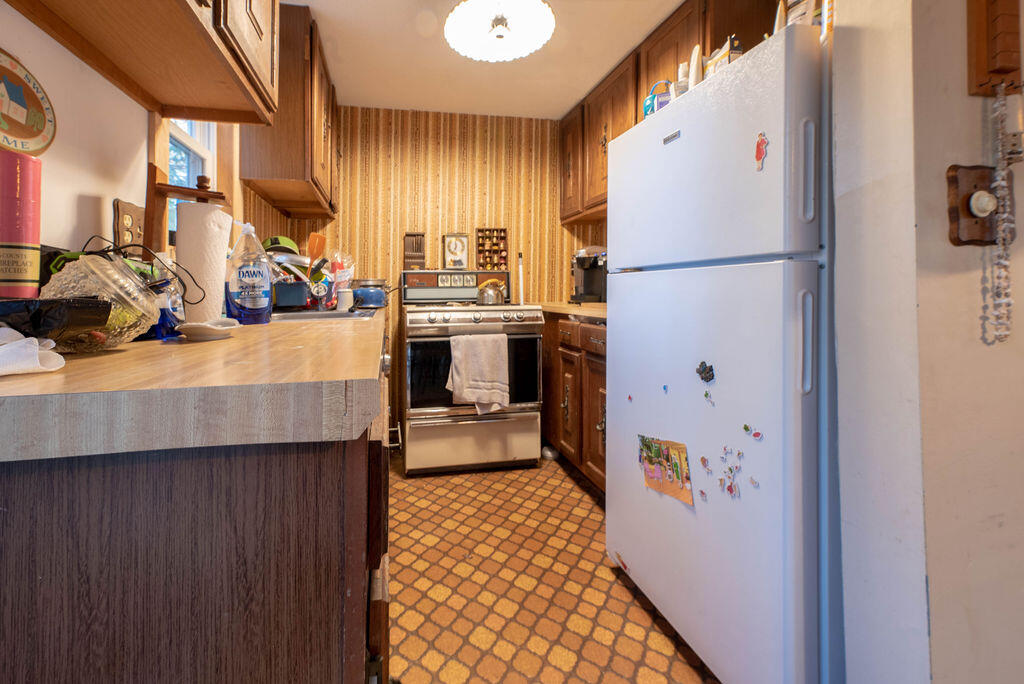 44 Deerfield Road Mashpee, MA 02649 - Photo 6 of 17 a kitchen with stainless steel appliances granite countertop a refrigerator and a sink