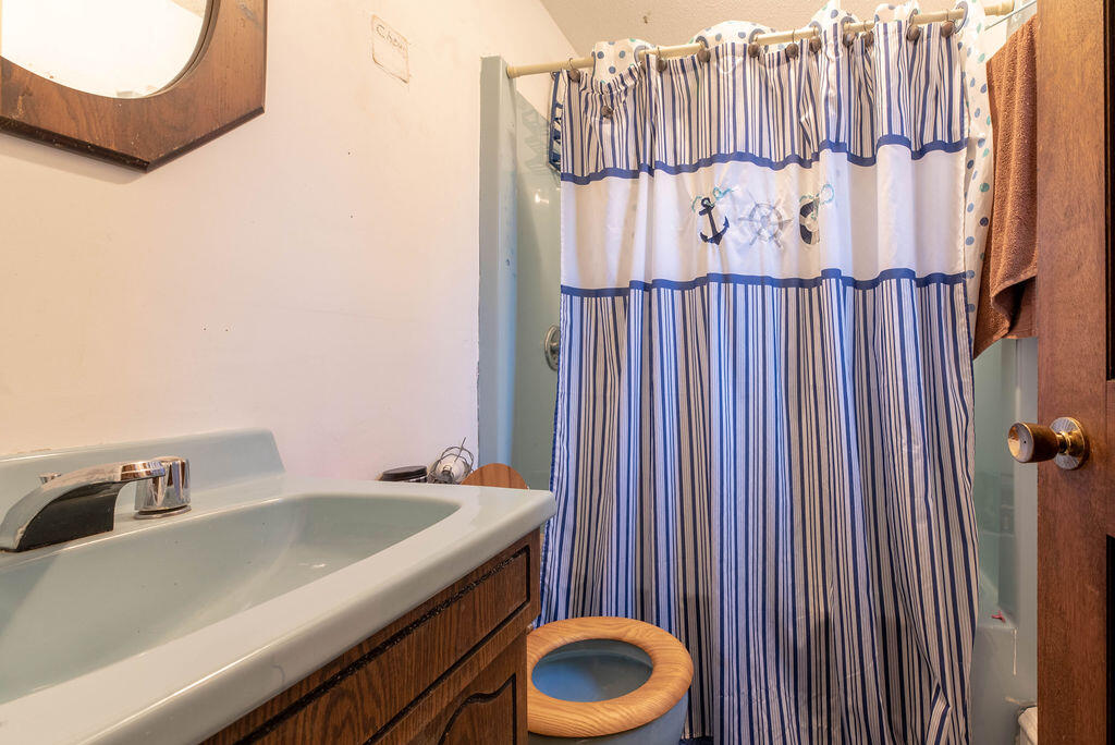 44 Deerfield Road Mashpee, MA 02649 - Photo 9 of 17 a bathroom with a sink and toilet