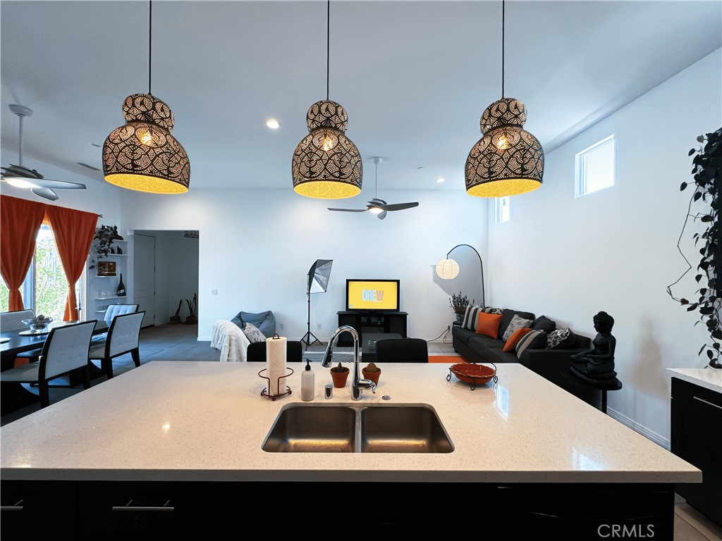 39995 Alba Way Palm Desert, CA 92211 - Photo 19 of 44 a kitchen with a table and a stove