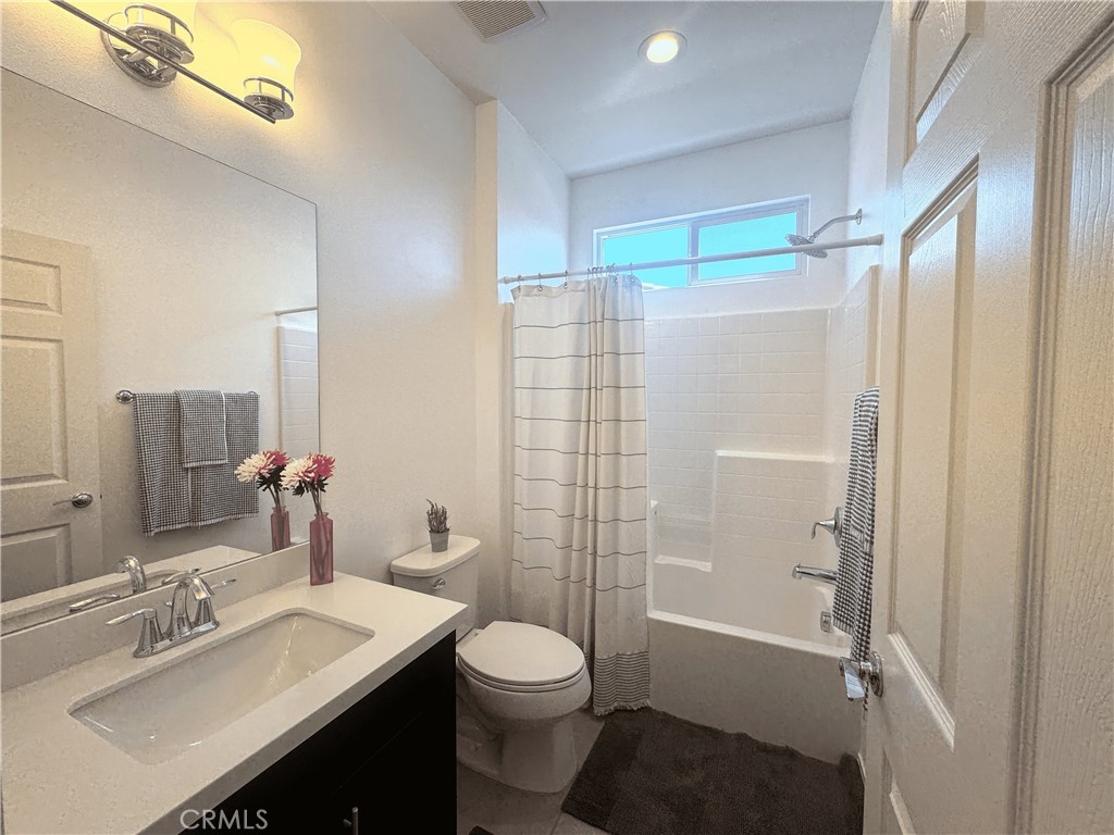 39995 Alba Way Palm Desert, CA 92211 - Photo 21 of 44 a bathroom with a sink a toilet and shower