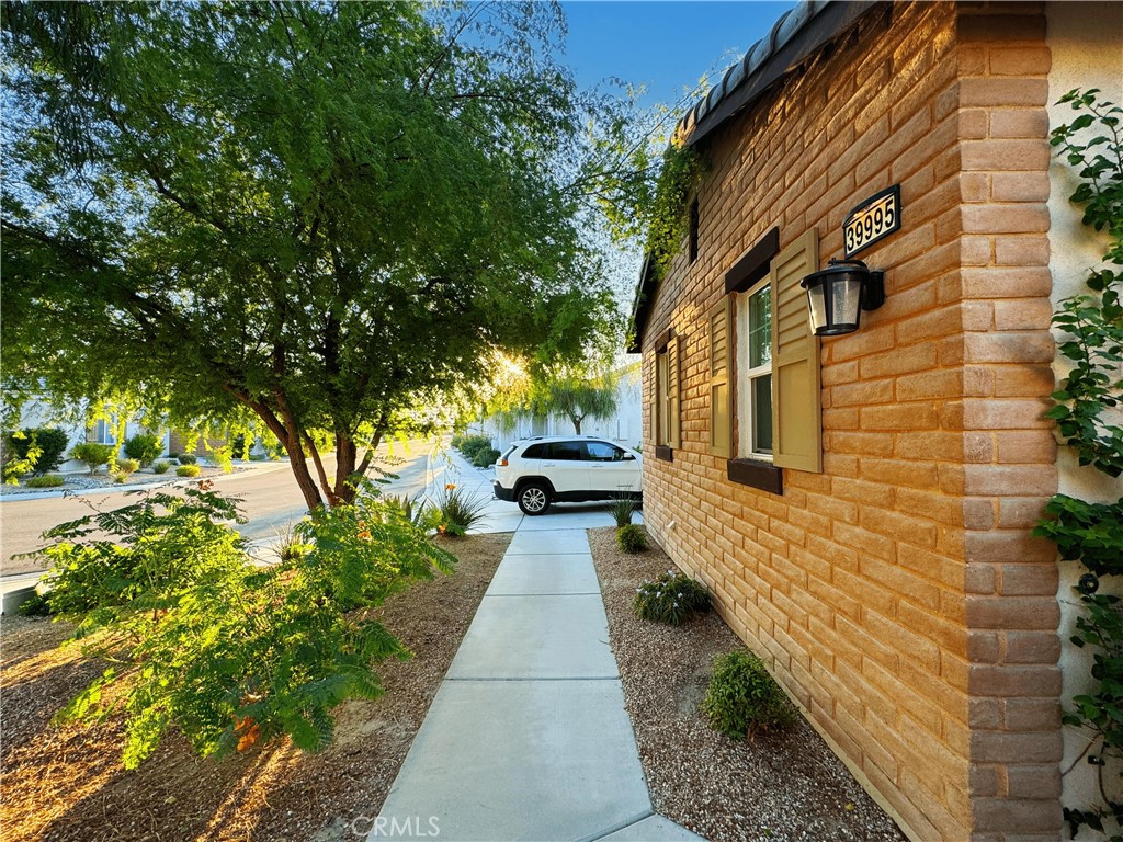39995 Alba Way Palm Desert, CA 92211 - Photo 3 of 44 a pathway of a house with a yard