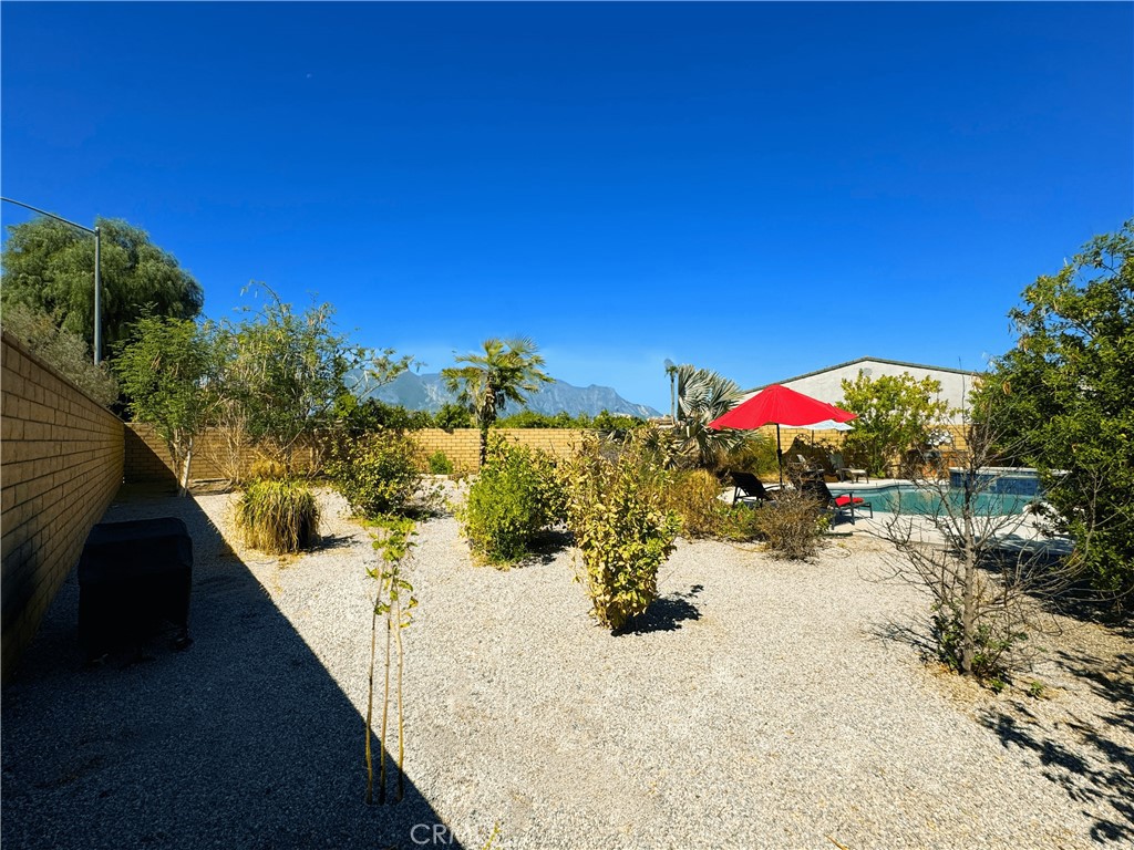 39995 Alba Way Palm Desert, CA 92211 - Photo 36 of 44 a view of a terrace with a garden