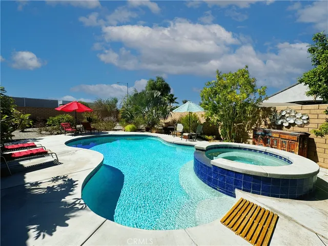 a view of pool table and chairs