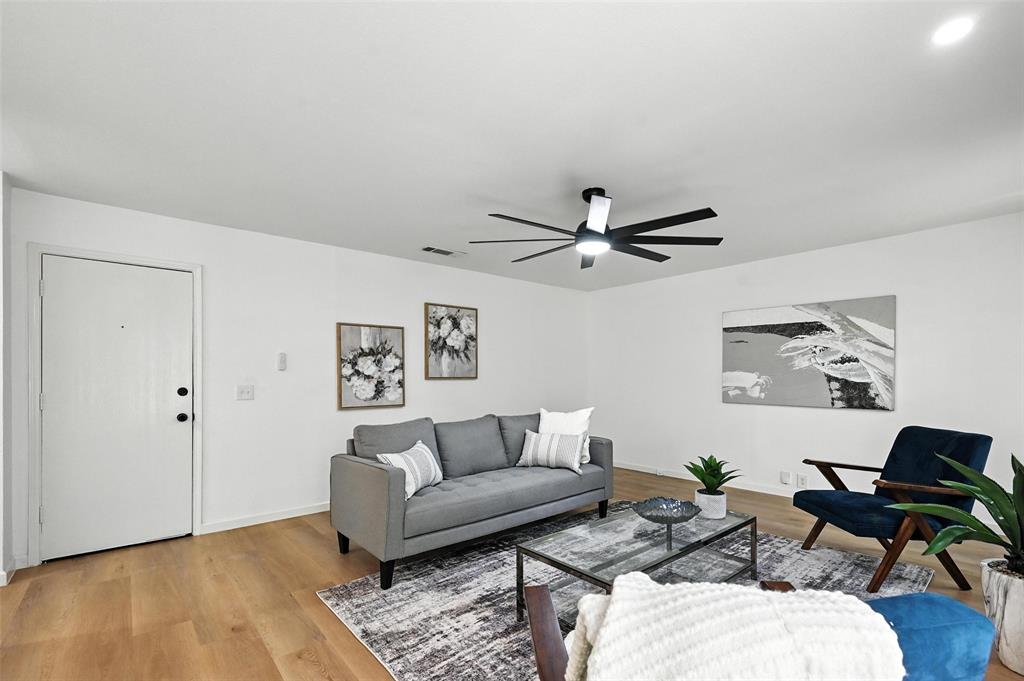6218 Everglade Road Dallas, TX 75227 - Photo 16 of 39 Living room featuring ceiling fan and light wood-style flooring