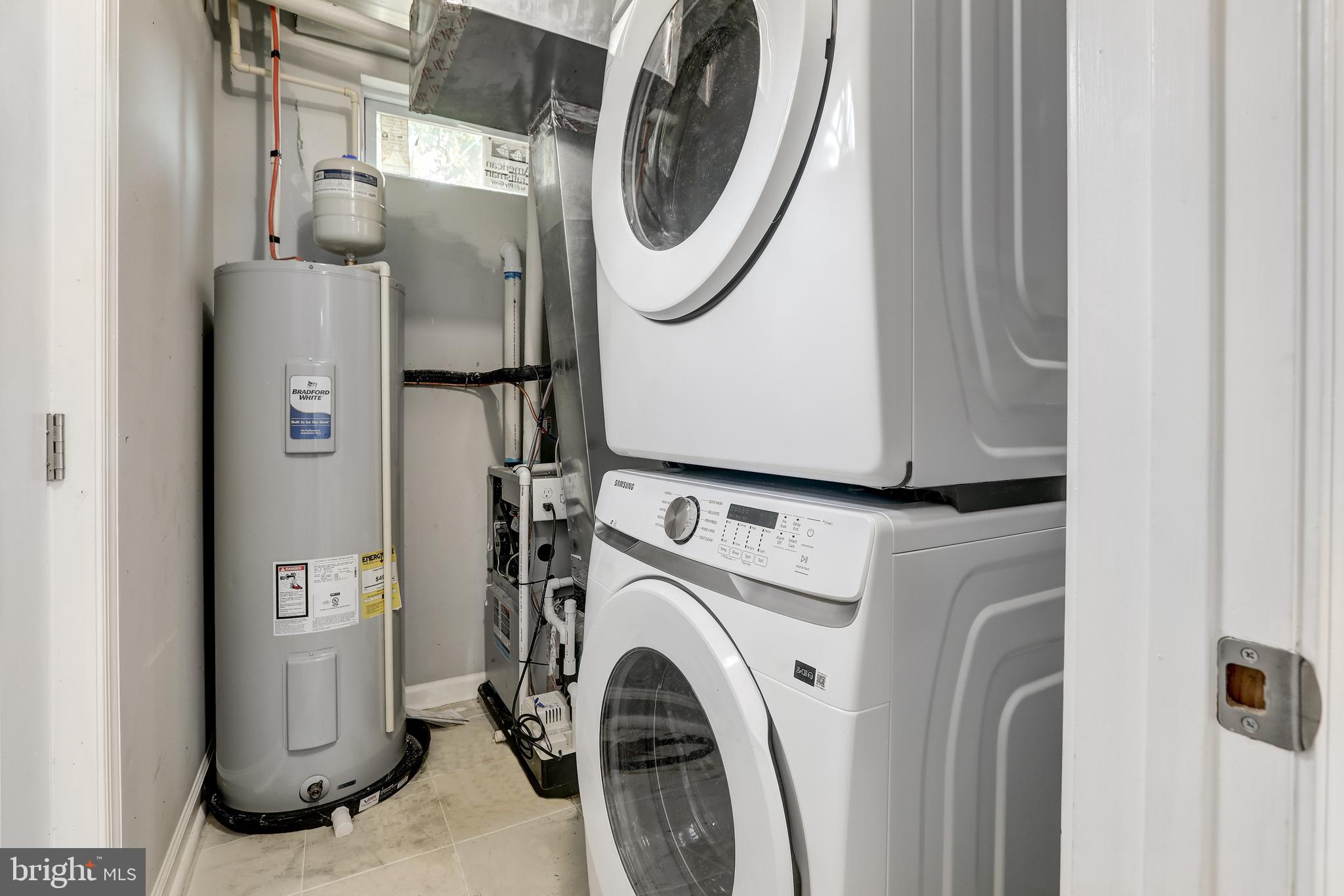 4015 Evans Chapel Road Baltimore, MD 21211 - Photo 24 of 50 a utility room with dryer and washer