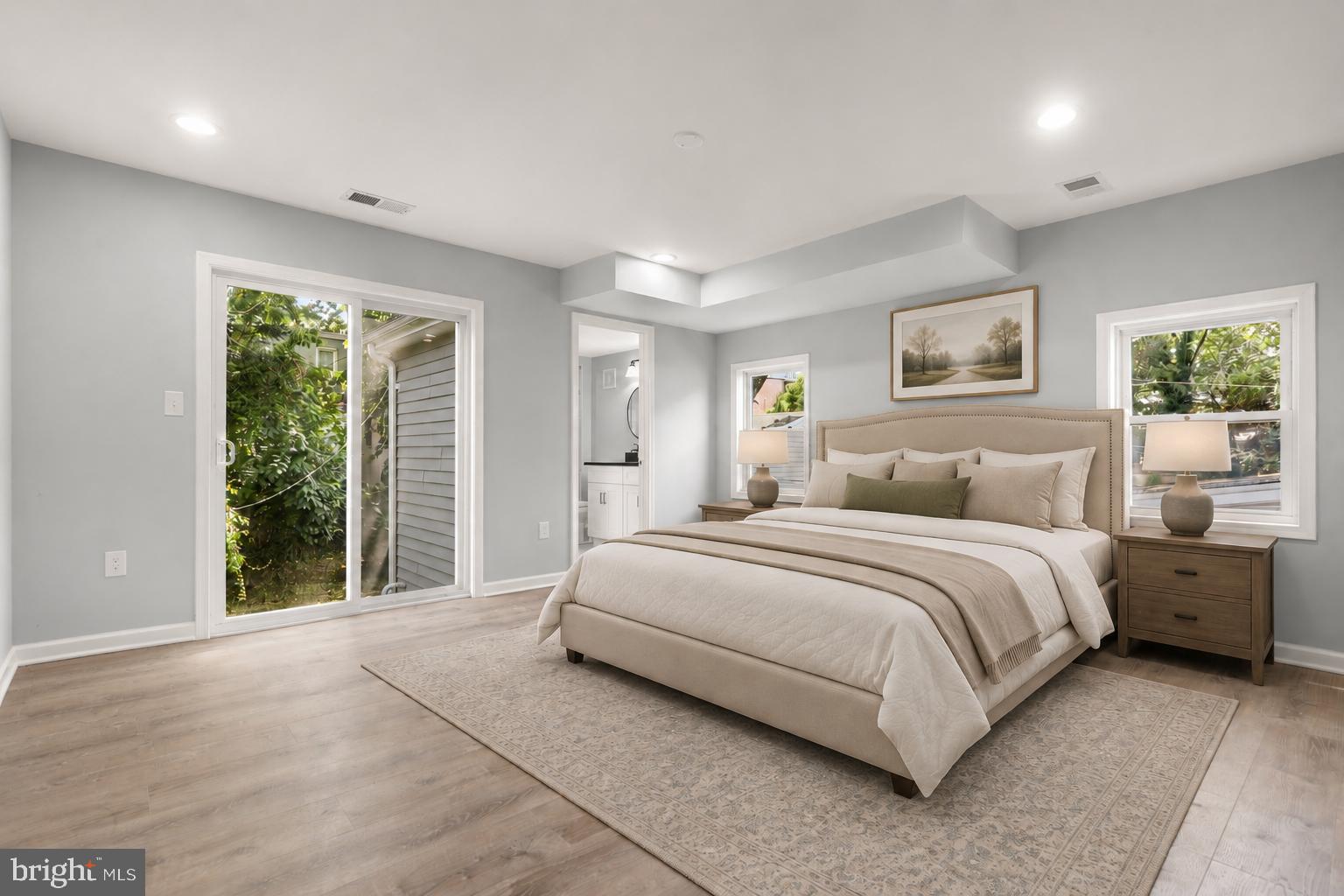 4015 Evans Chapel Road Baltimore, MD 21211 - Photo 27 of 50 a spacious bedroom with a large bed and a large window