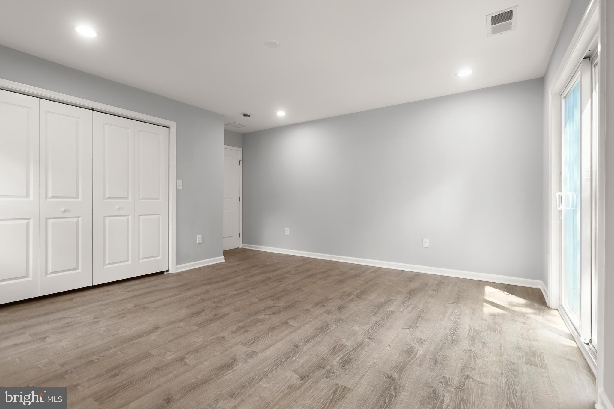 4015 Evans Chapel Road Baltimore, MD 21211 - Photo 29 of 50 wooden floor in an empty room with a window