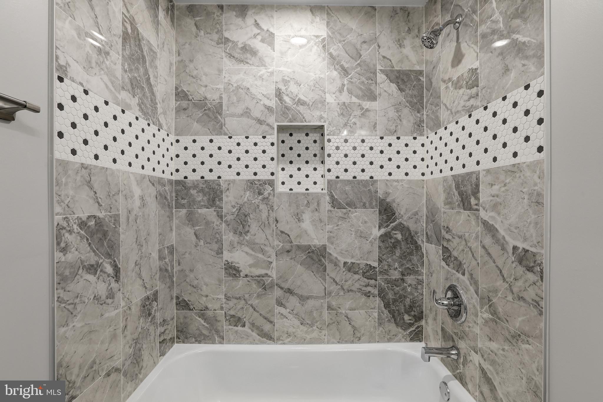 4015 Evans Chapel Road Baltimore, MD 21211 - Photo 36 of 50 a bathroom with a bathtub