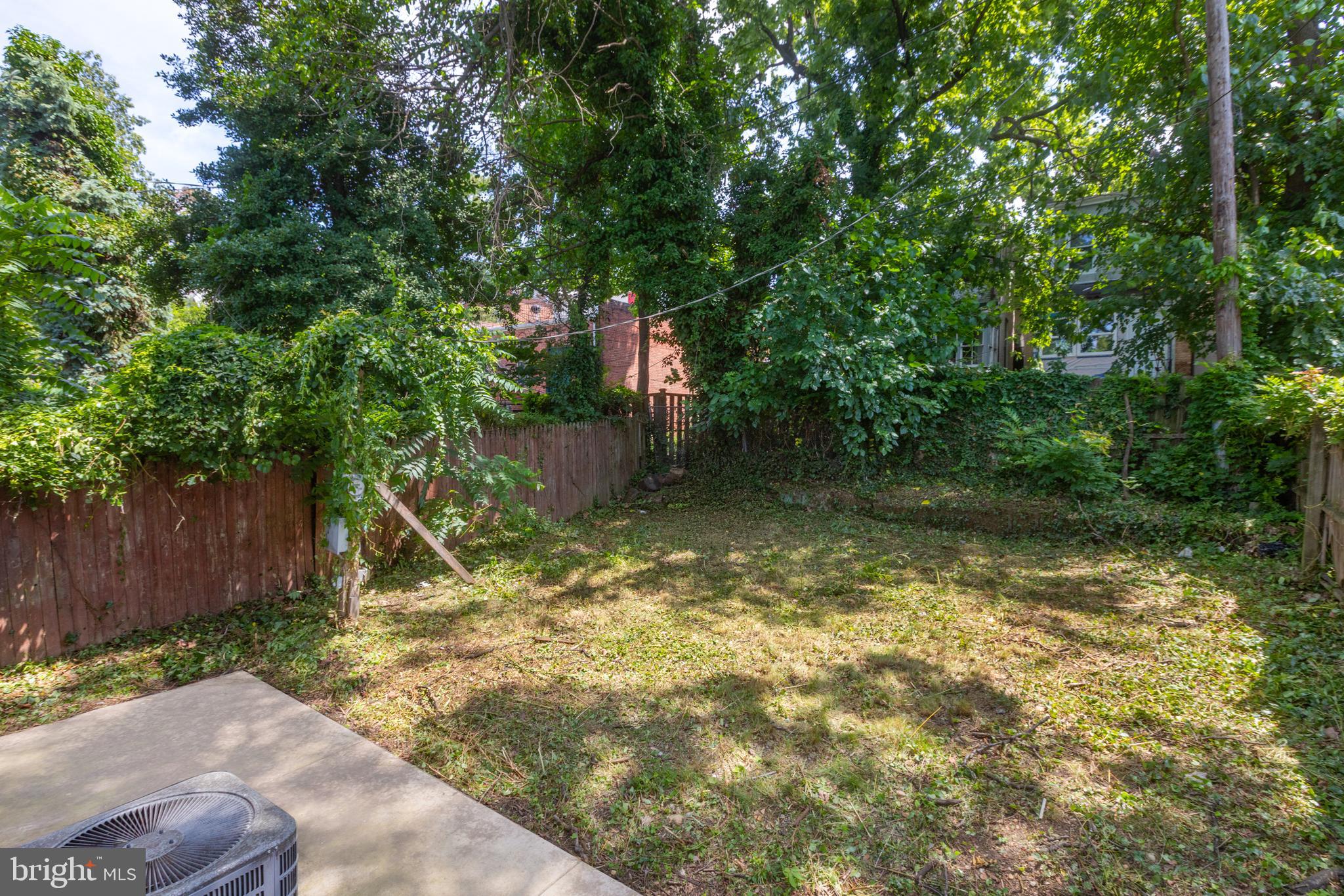 4015 Evans Chapel Road Baltimore, MD 21211 - Photo 45 of 50 a backyard of a house with lots of green space