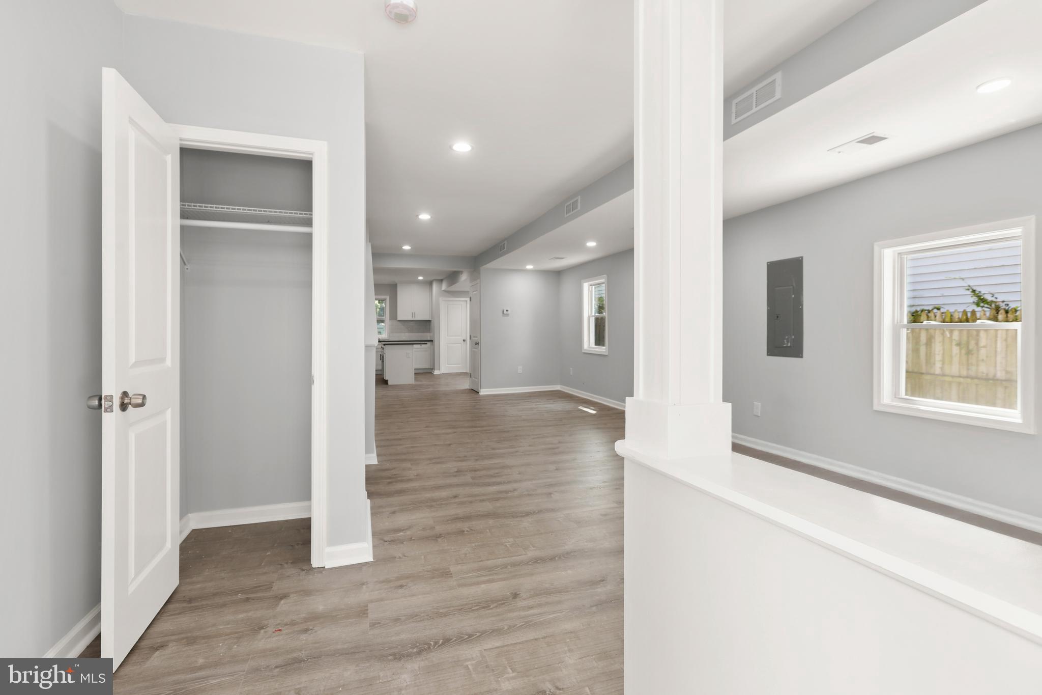 4015 Evans Chapel Road Baltimore, MD 21211 - Photo 7 of 50 a view of a hallway with wooden floor and a living room