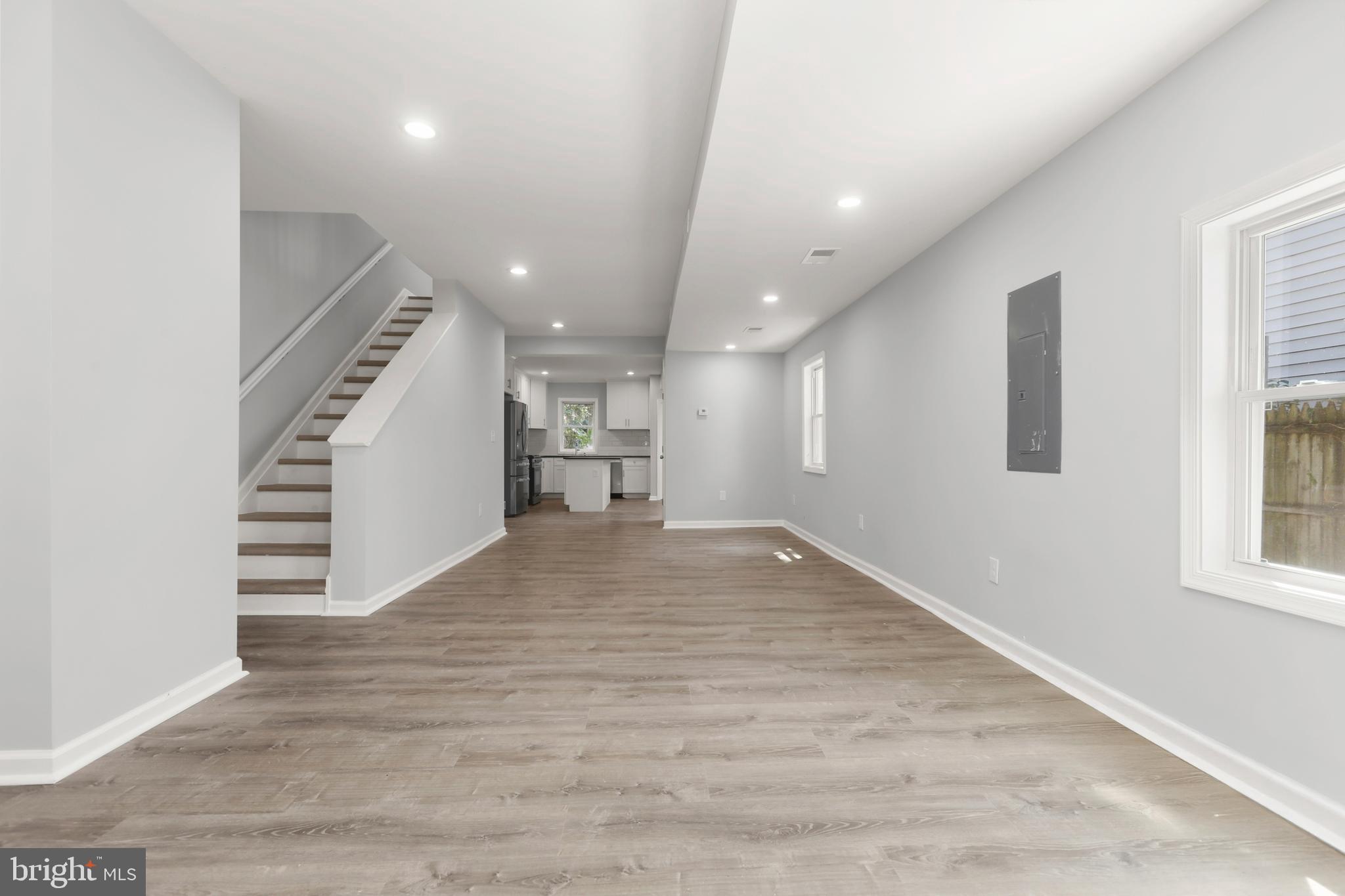 4015 Evans Chapel Road Baltimore, MD 21211 - Photo 10 of 50 an empty room with wooden floor and entryway