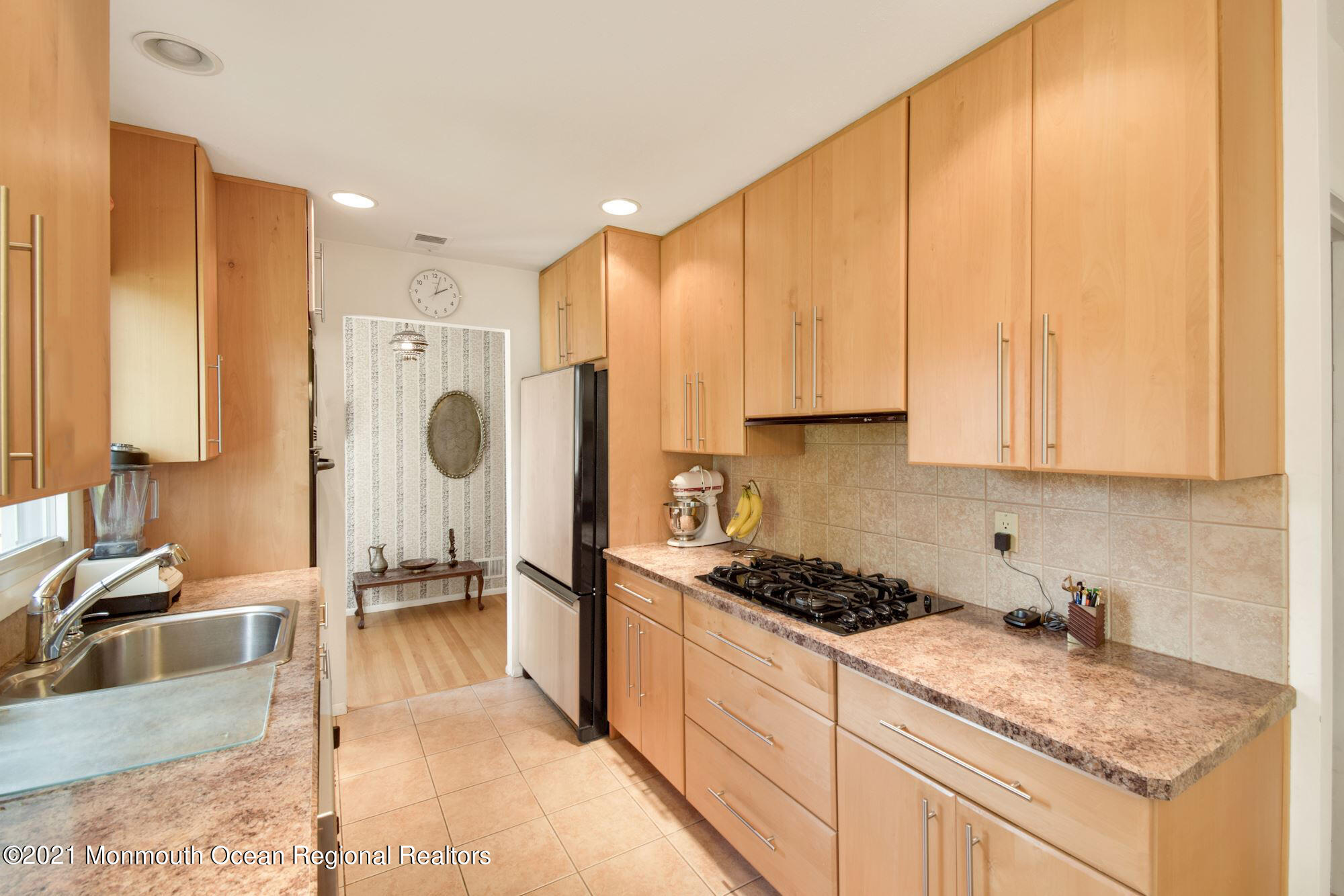 36 Coldspring Road Freehold, NJ 07728 - Photo 11 of 37 a kitchen with stainless steel appliances granite countertop a sink stove and refrigerator