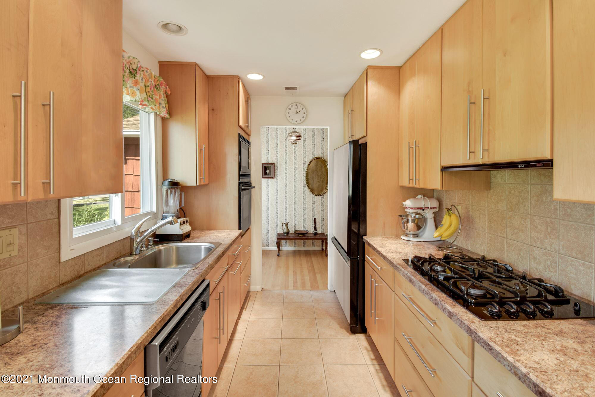36 Coldspring Road Freehold, NJ 07728 - Photo 12 of 37 a kitchen with kitchen island granite countertop a sink and stainless steel appliances