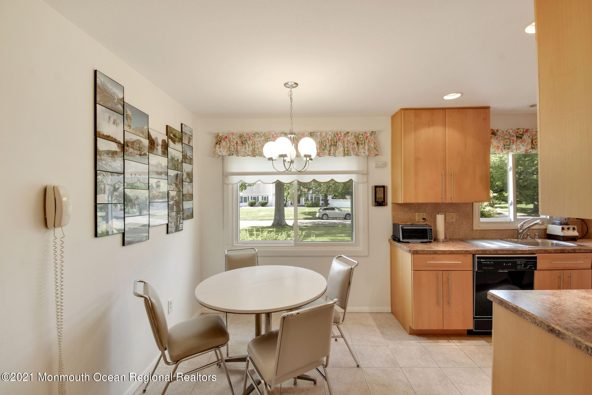 36 Coldspring Road Freehold, NJ 07728 - Photo 13 of 37 a kitchen with a table chairs sink and cabinets
