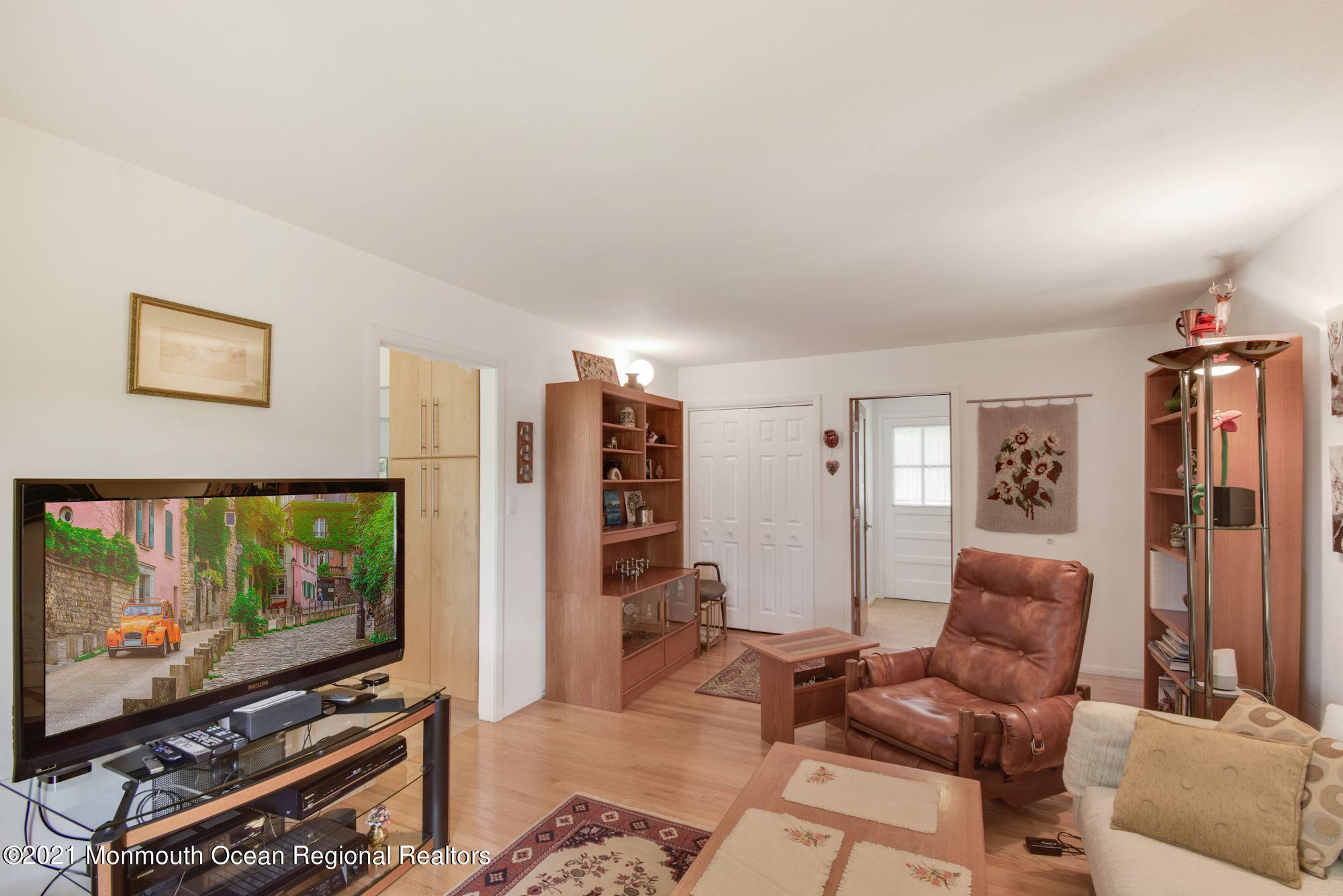 36 Coldspring Road Freehold, NJ 07728 - Photo 14 of 37 a living room with furniture and a flat screen tv
