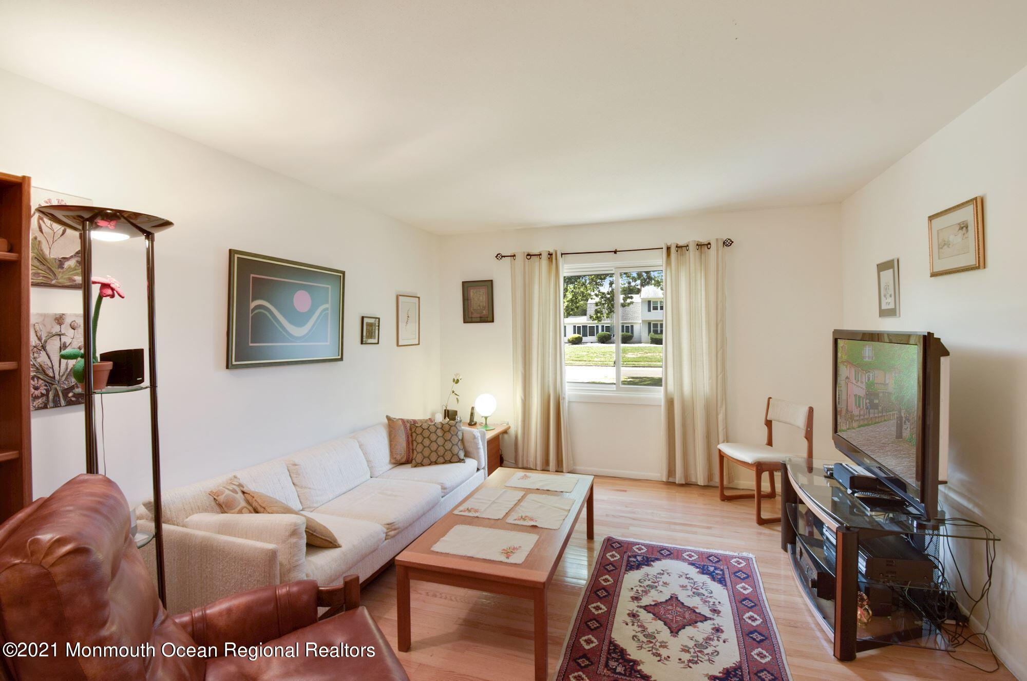 36 Coldspring Road Freehold, NJ 07728 - Photo 15 of 37 a living room with furniture and a flat screen tv