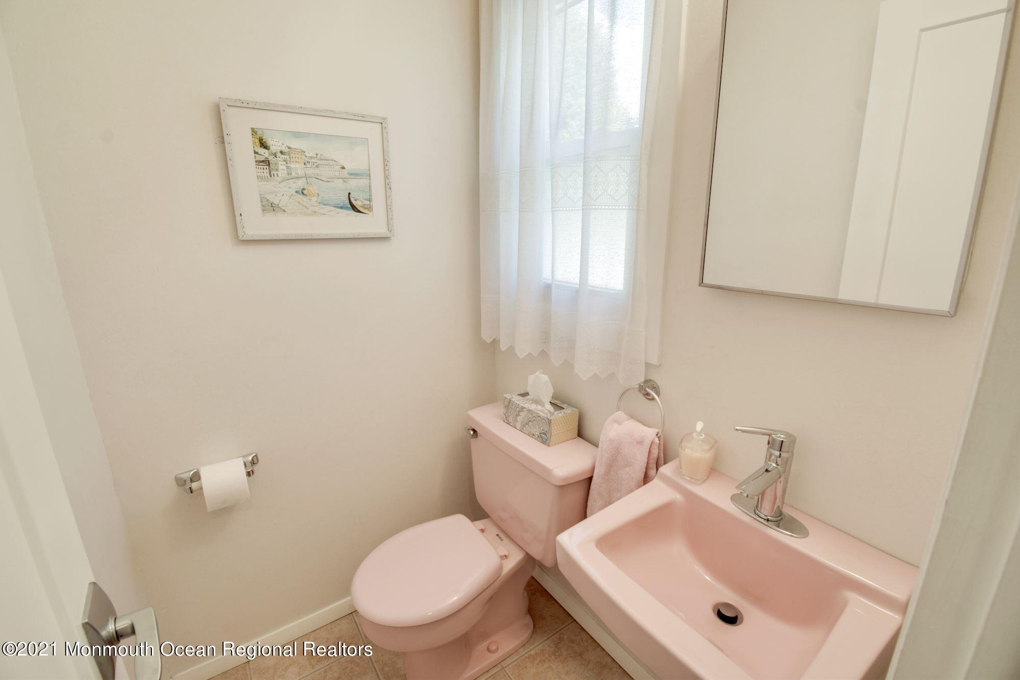36 Coldspring Road Freehold, NJ 07728 - Photo 17 of 37 a bathroom with a toilet sink and mirror
