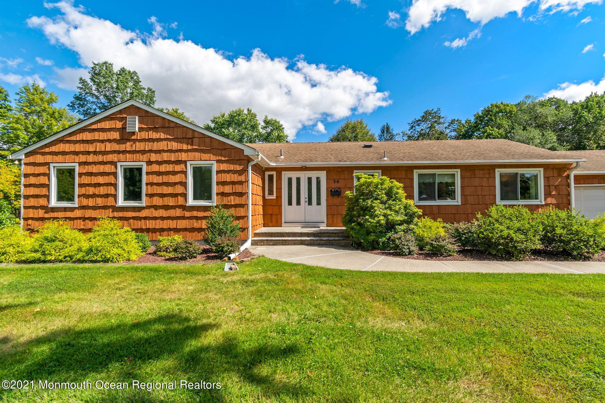 36 Coldspring Road Freehold, NJ 07728 - Photo 4 of 37 a front view of a house with a yard