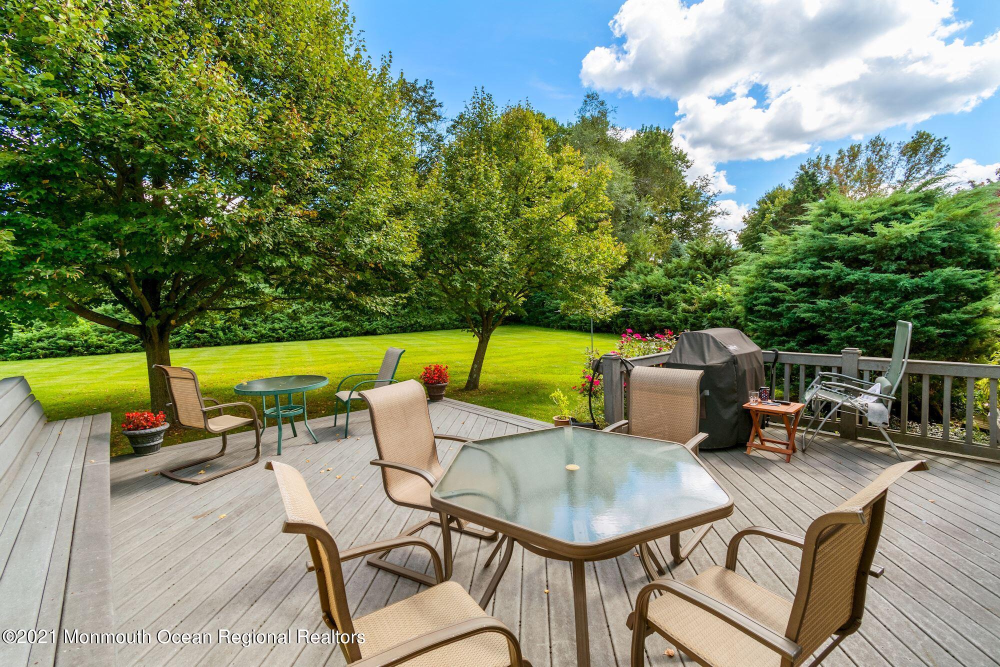 36 Coldspring Road Freehold, NJ 07728 - Photo 31 of 37 an outdoor sitting area with furniture and garden view