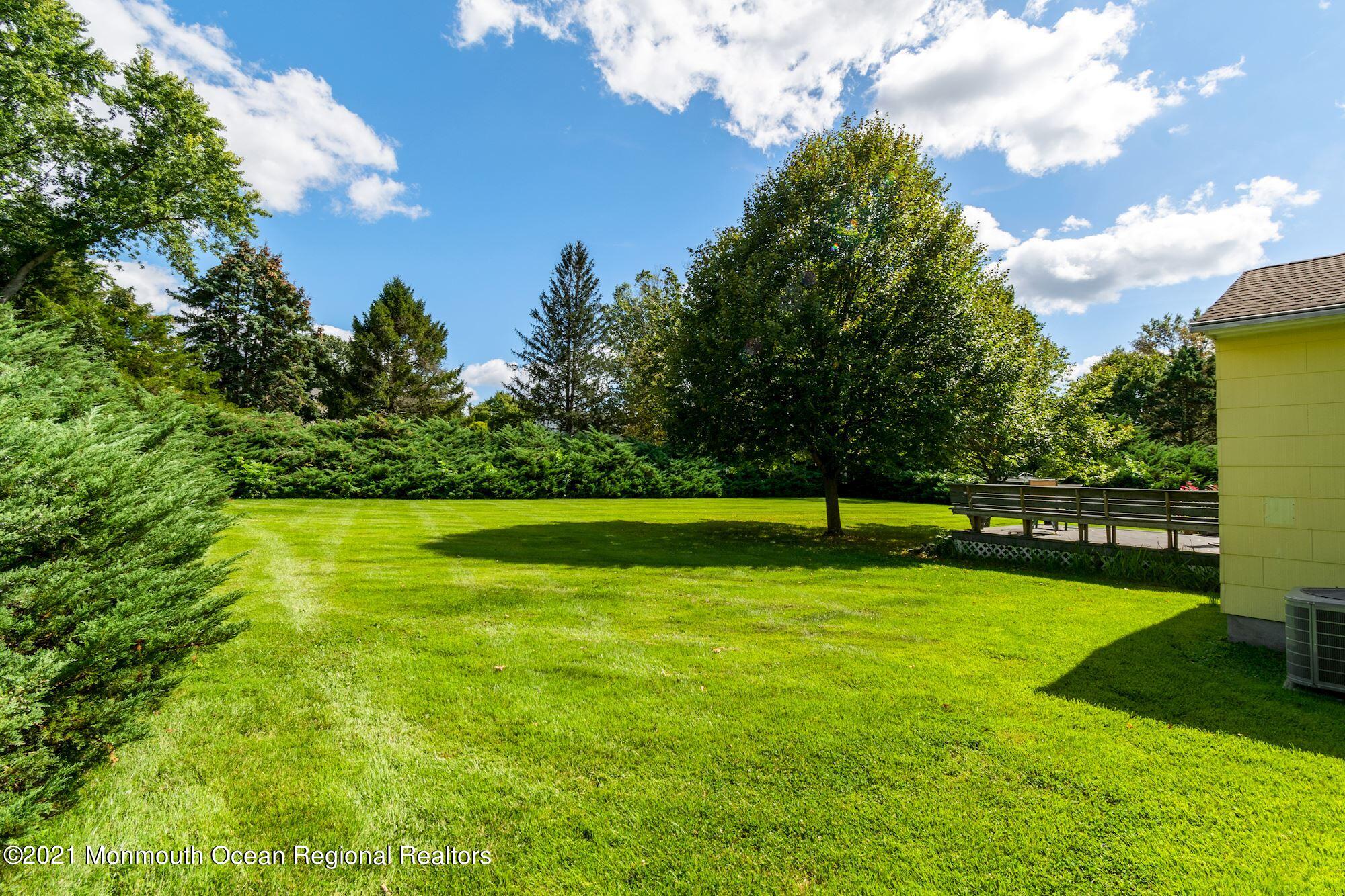36 Coldspring Road Freehold, NJ 07728 - Photo 32 of 37 a view of a golf course with a lake