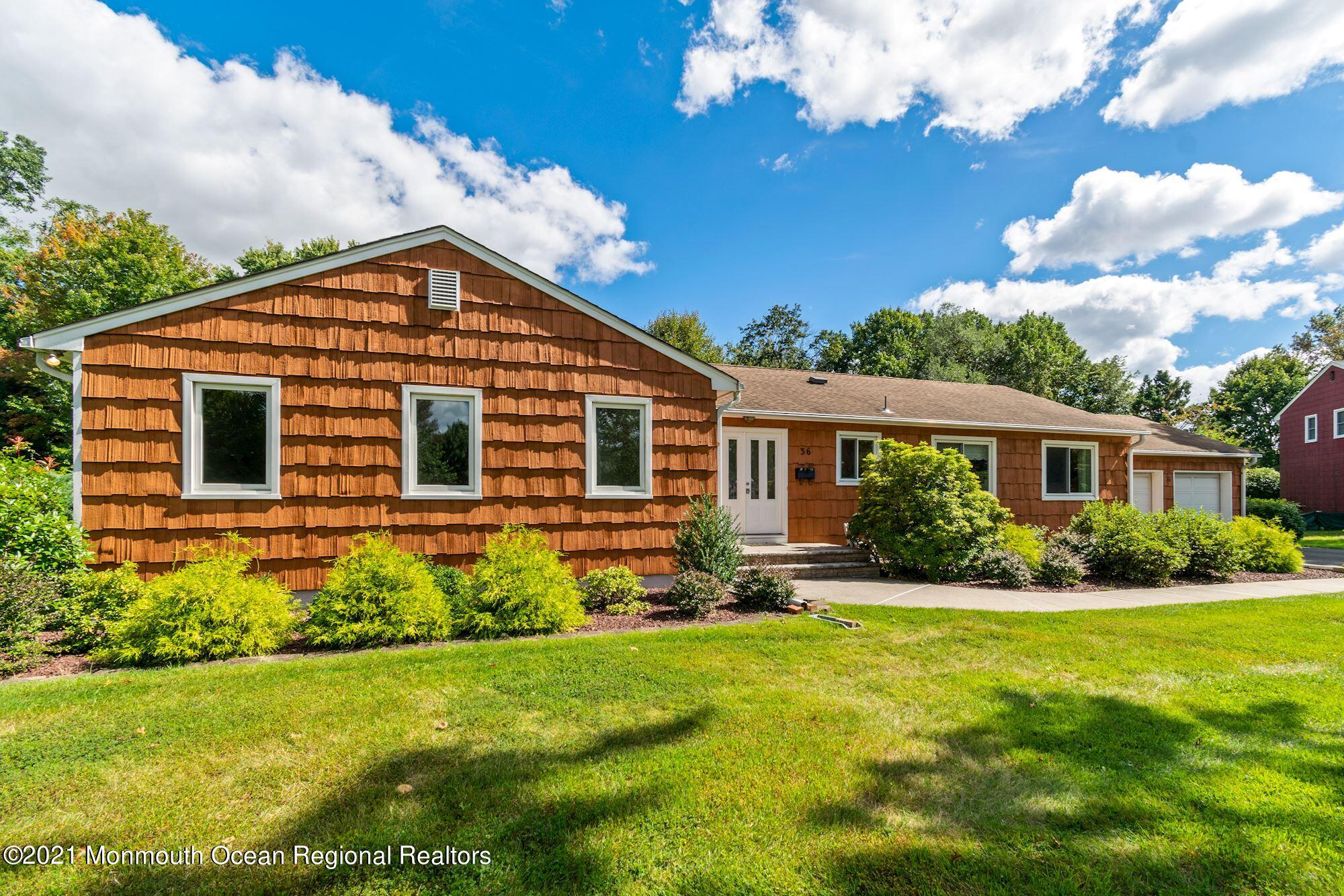 36 Coldspring Road Freehold, NJ 07728 - Photo 5 of 37 a front view of a house with a yard