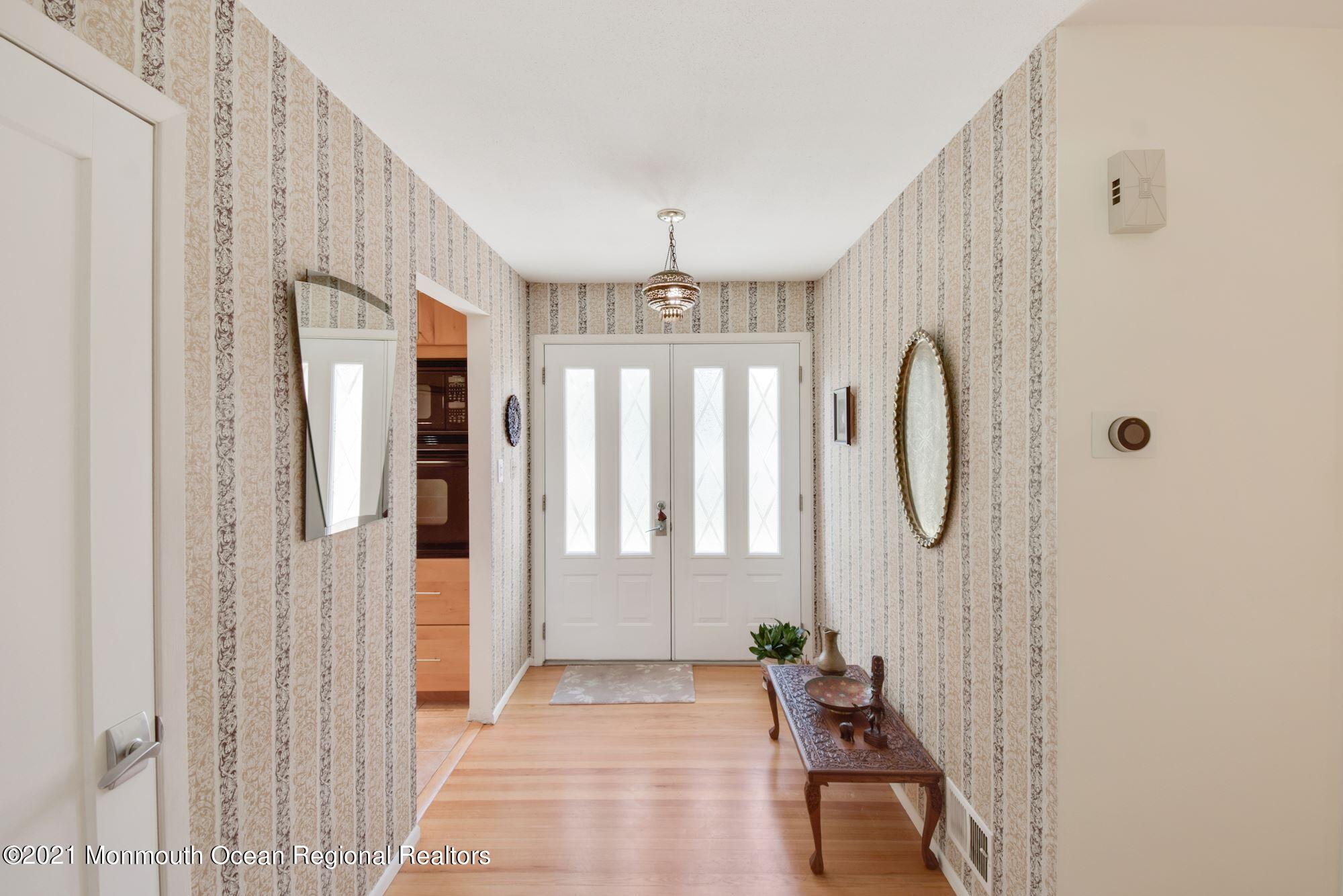 36 Coldspring Road Freehold, NJ 07728 - Photo 6 of 37 a very nice looking room with a large window and chandelier