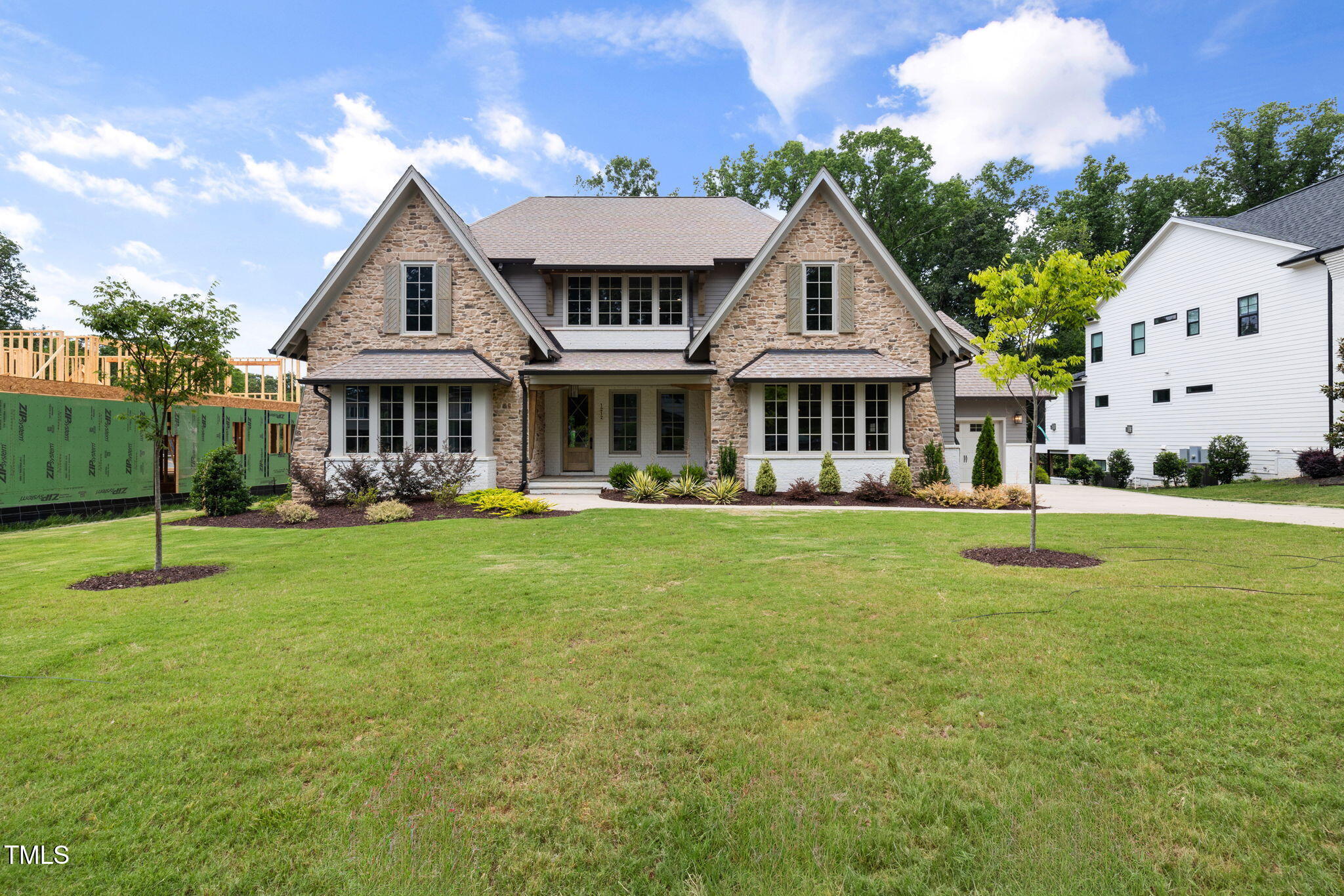 1212 Gunnison Place Raleigh, NC 27609 - Photo 1 of 53 a front view of a house with a yard table and chairs