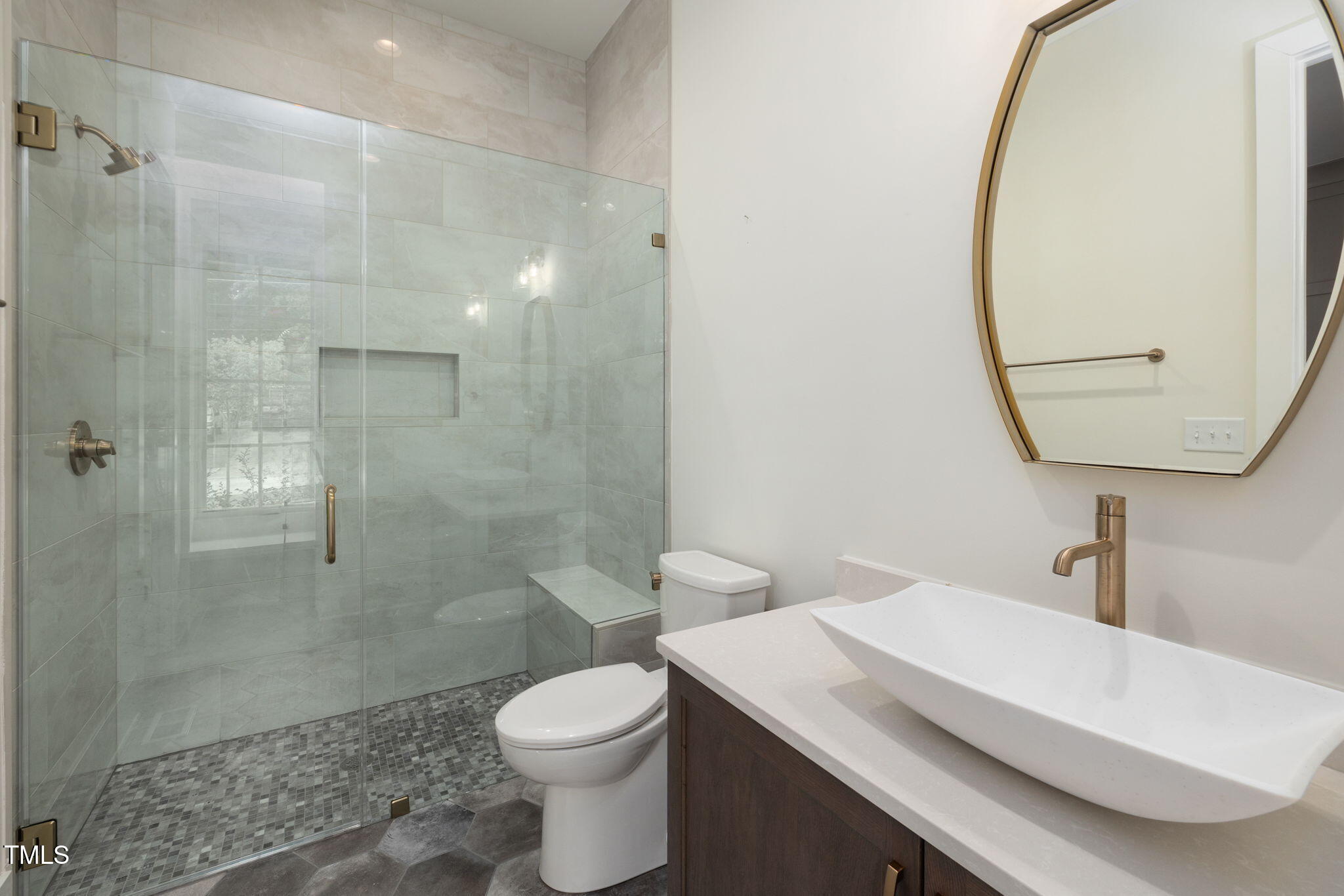 1212 Gunnison Place Raleigh, NC 27609 - Photo 10 of 53 a bathroom with a sink a toilet and shower