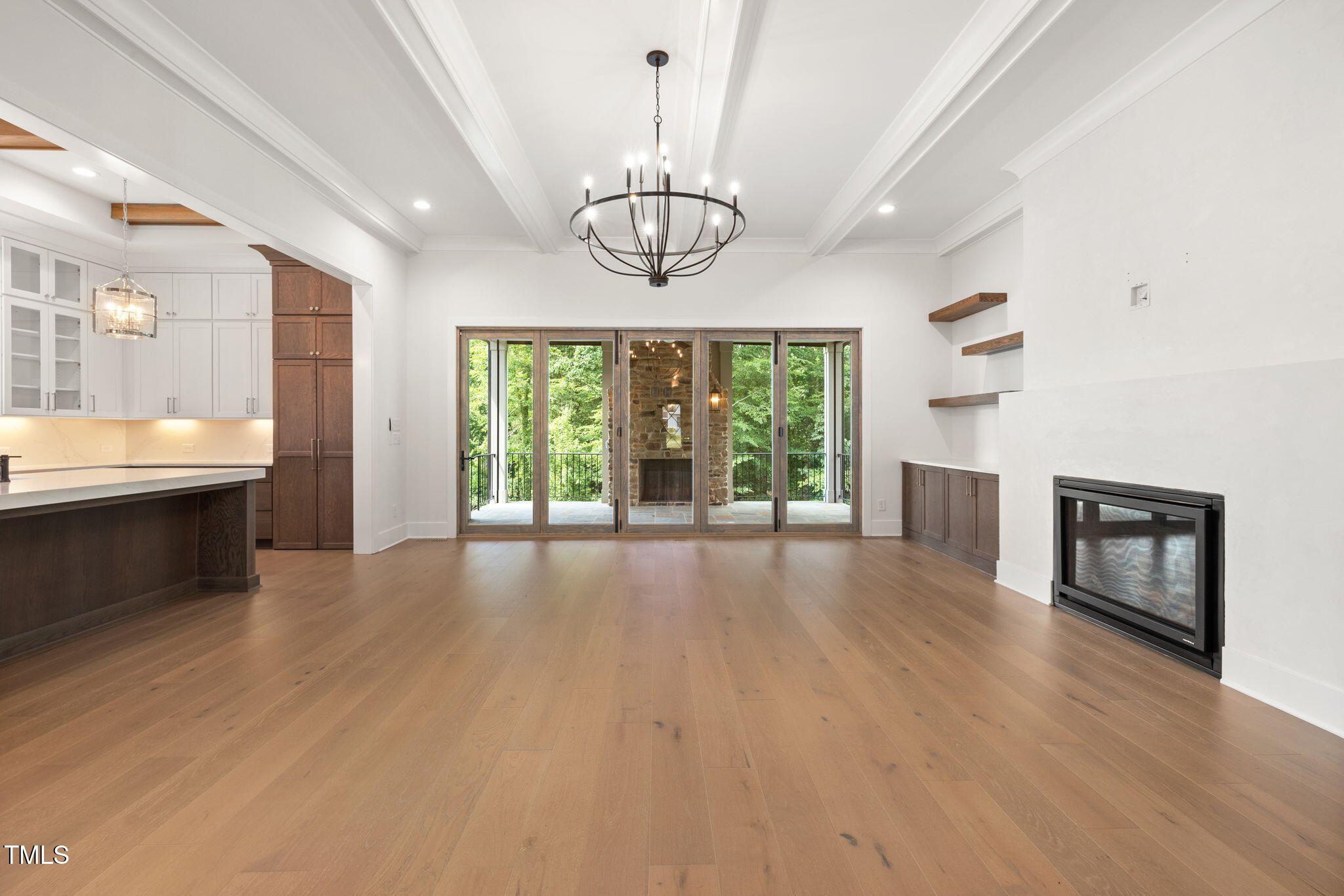 1212 Gunnison Place Raleigh, NC 27609 - Photo 11 of 53 a view of an empty room with a window and wooden floor