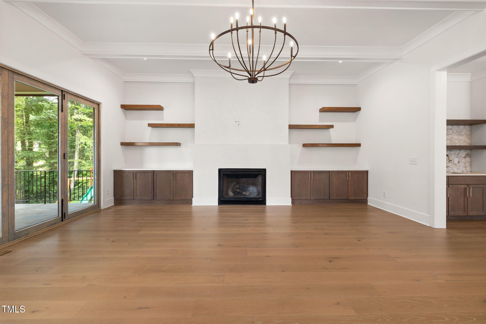 1212 Gunnison Place Raleigh, NC 27609 - Photo 15 of 53 a view of a livingroom with a fireplace cabinet and a window