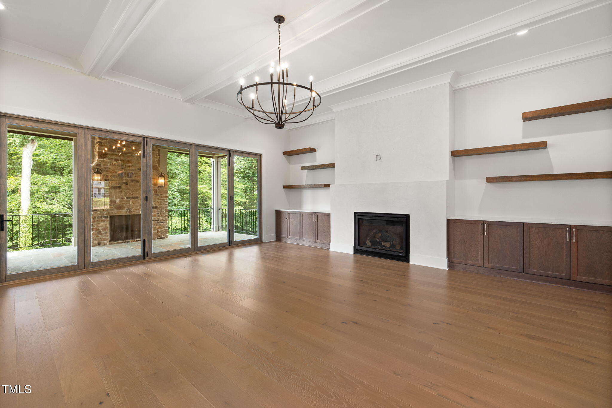 1212 Gunnison Place Raleigh, NC 27609 - Photo 16 of 53 a view of a livingroom with furniture wooden floor fireplace and windows