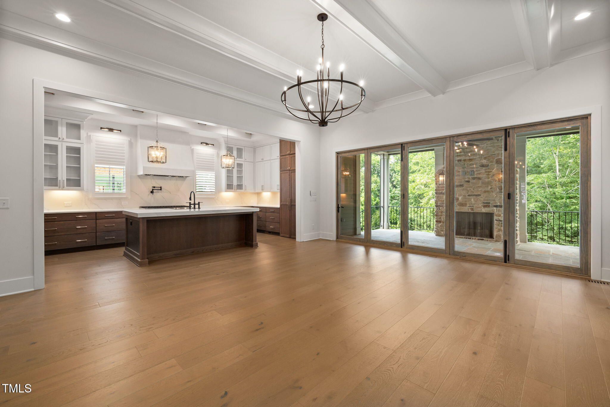 1212 Gunnison Place Raleigh, NC 27609 - Photo 17 of 53 a view of large kitchen with a large window stainless steel appliances granite countertop a stove and wooden floors