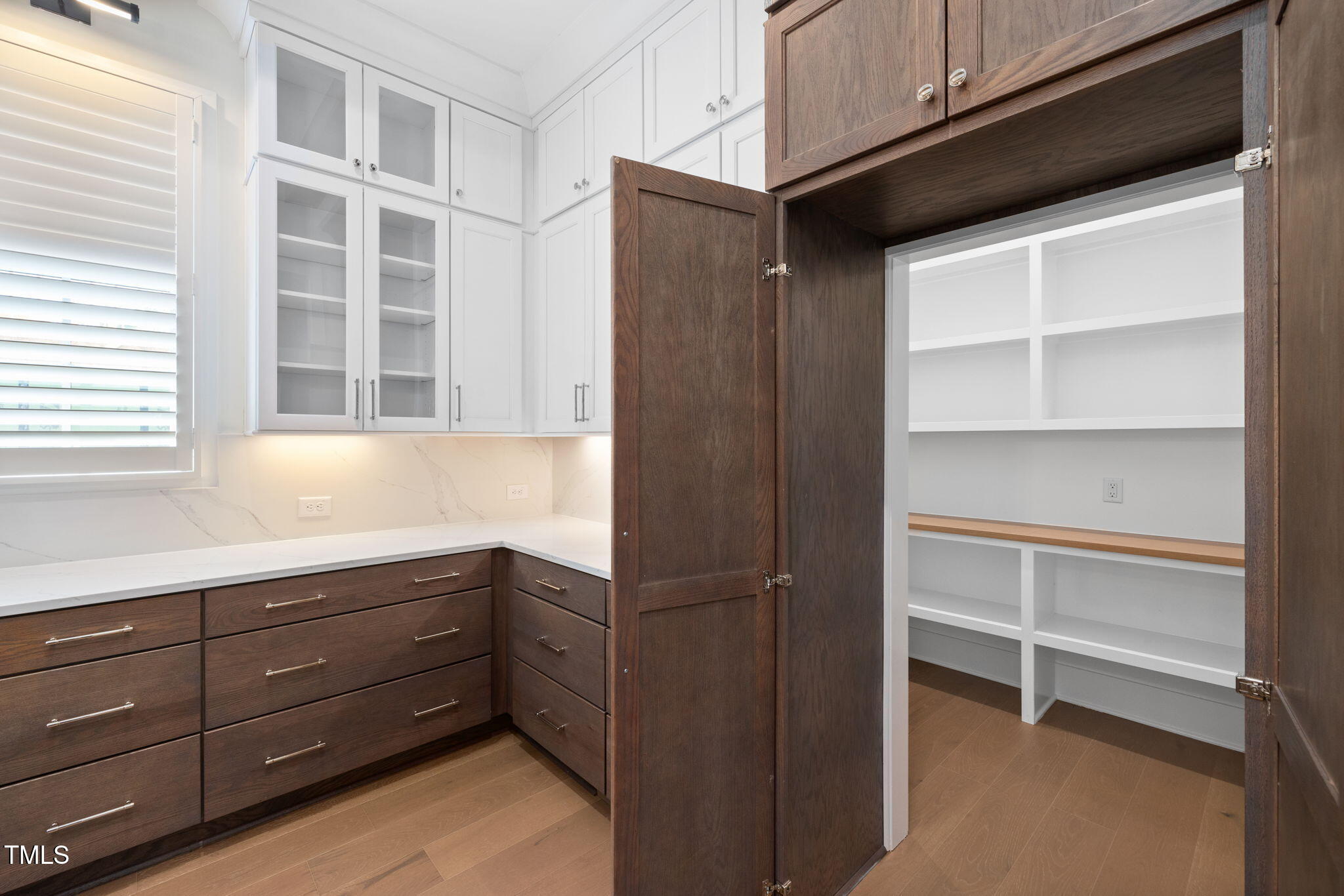 1212 Gunnison Place Raleigh, NC 27609 - Photo 20 of 53 a kitchen with cabinets and window