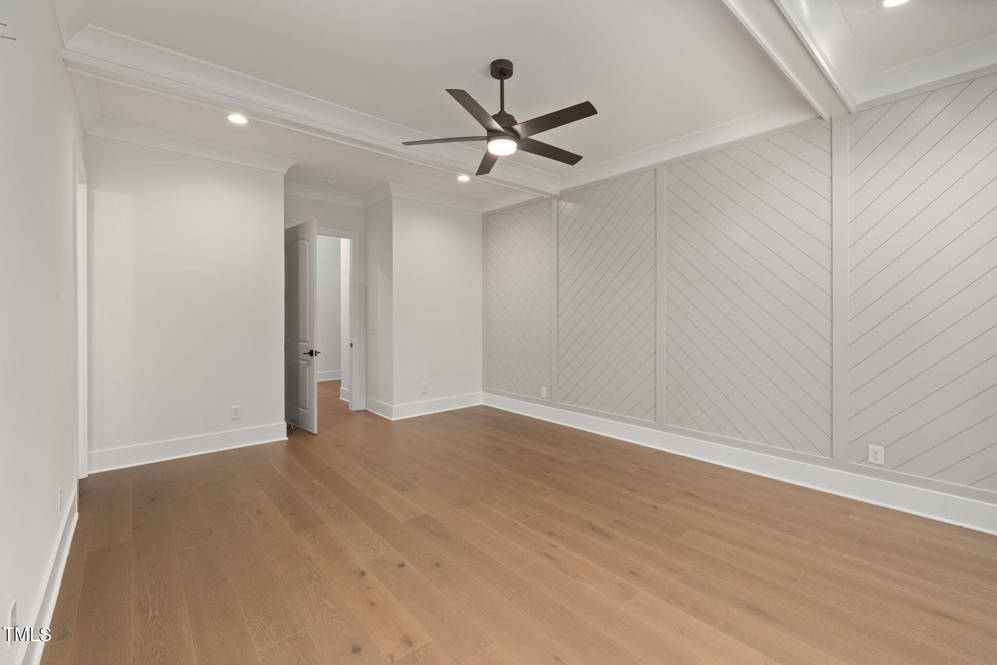1212 Gunnison Place Raleigh, NC 27609 - Photo 27 of 53 an empty room with wooden floor ceiling fan and windows