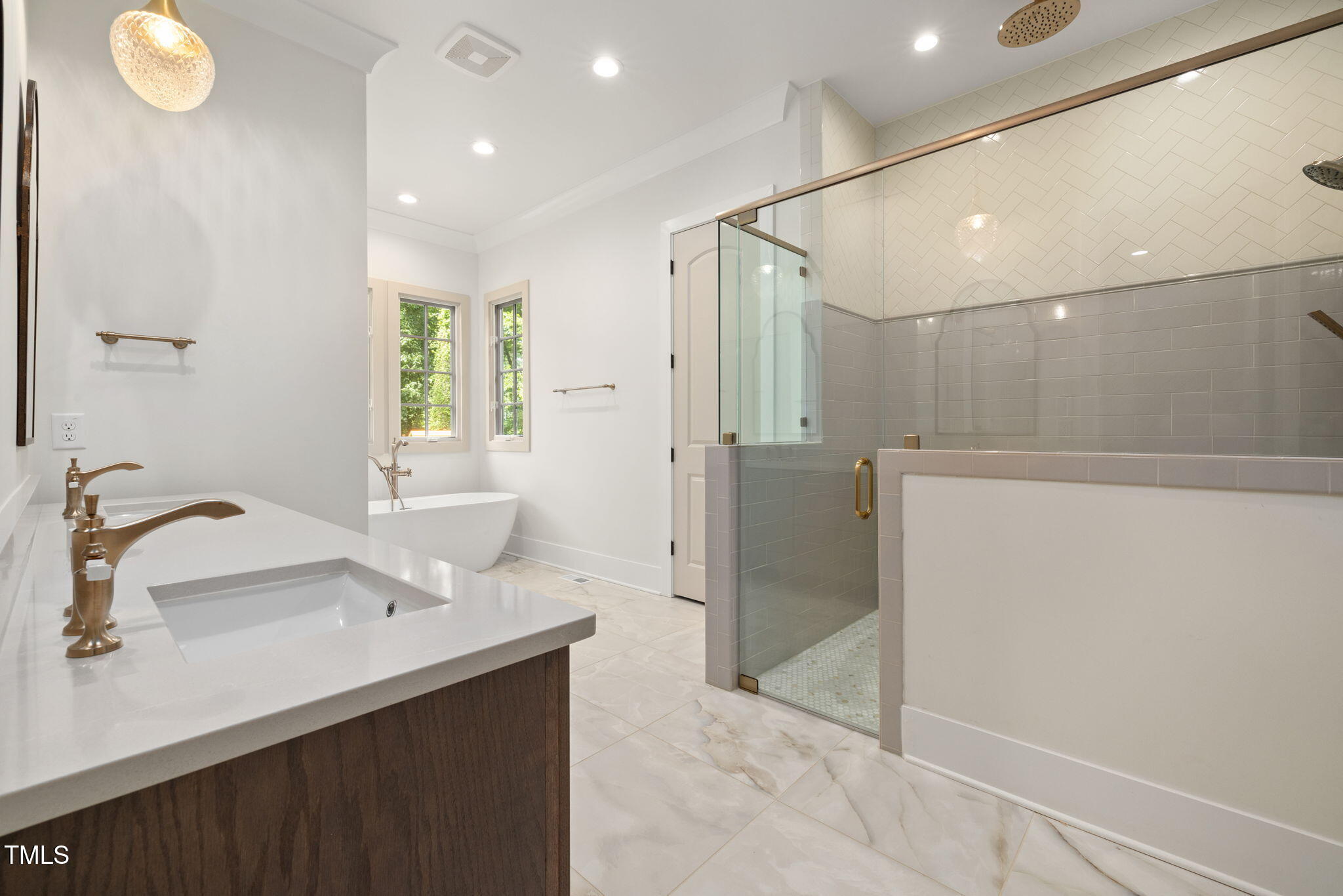 1212 Gunnison Place Raleigh, NC 27609 - Photo 28 of 53 a bathroom with a sink and a mirror