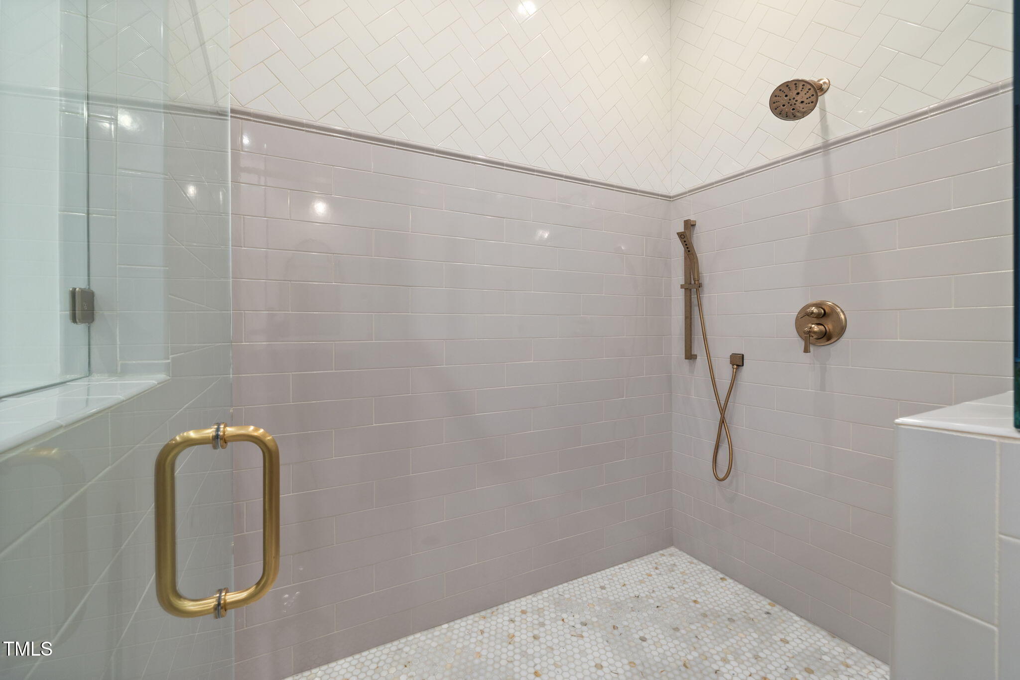 1212 Gunnison Place Raleigh, NC 27609 - Photo 30 of 53 a bathroom with a shower and a mirror