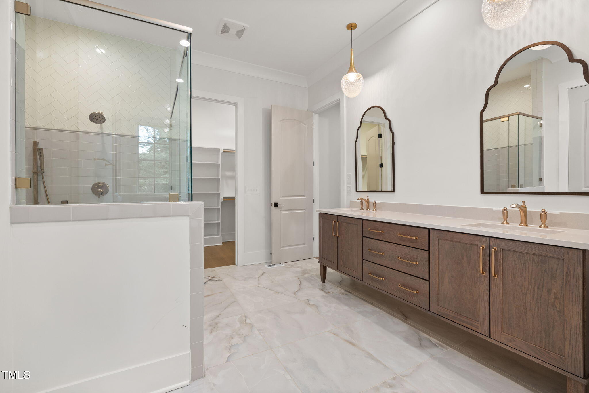 1212 Gunnison Place Raleigh, NC 27609 - Photo 31 of 53 a spacious bathroom with a double vanity sink mirror and double