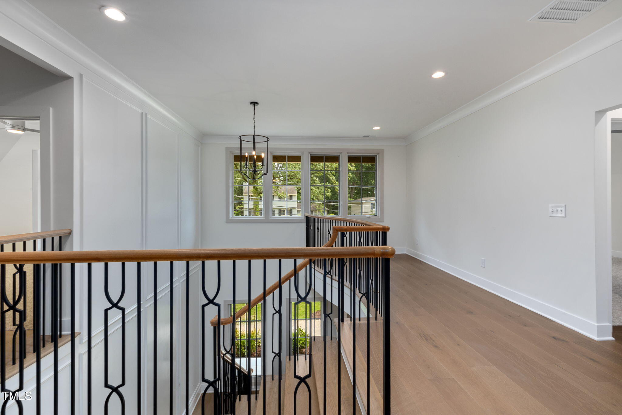 1212 Gunnison Place Raleigh, NC 27609 - Photo 34 of 53 a view of a hallway with a window