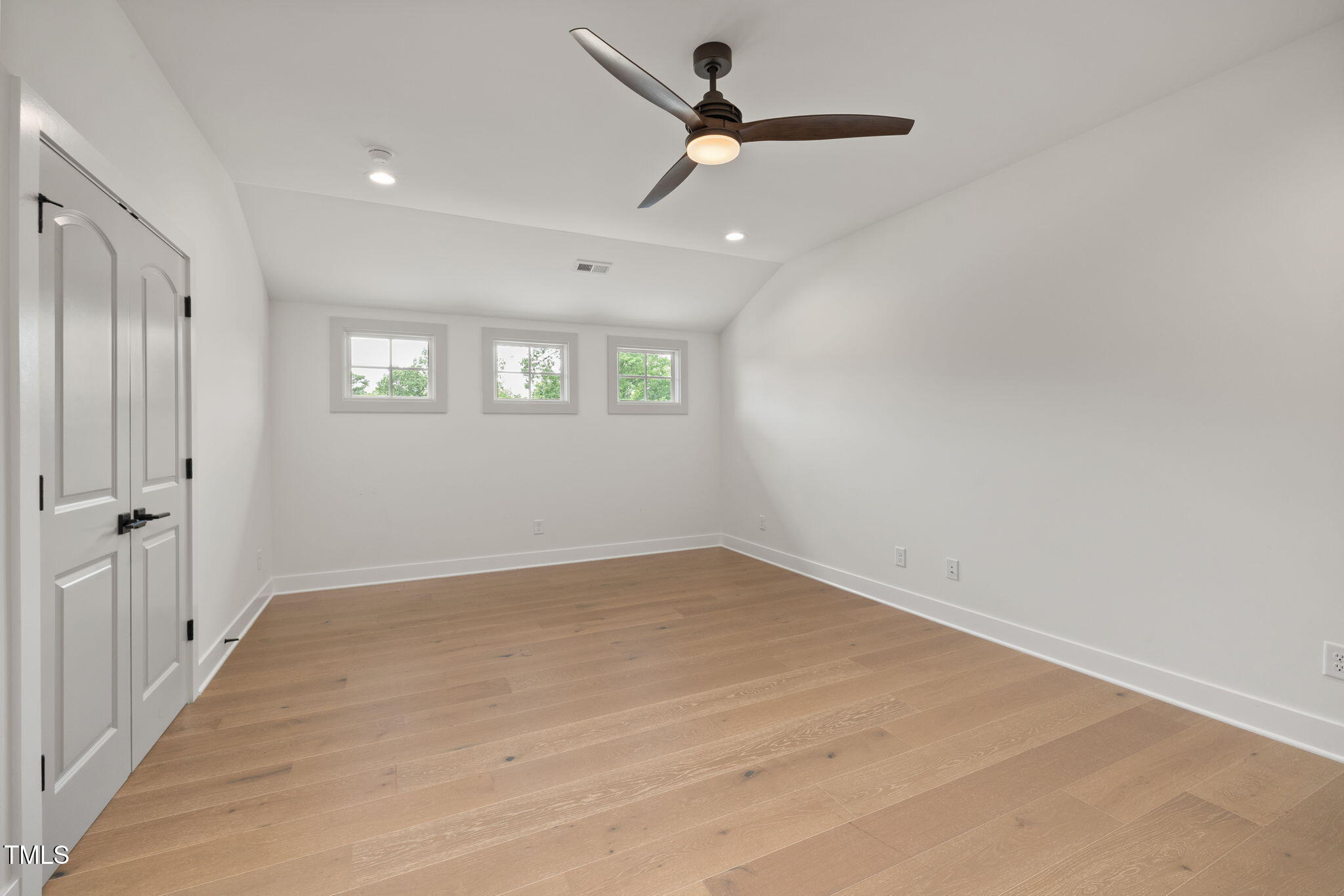 1212 Gunnison Place Raleigh, NC 27609 - Photo 41 of 53 wooden floor in an empty room with a window